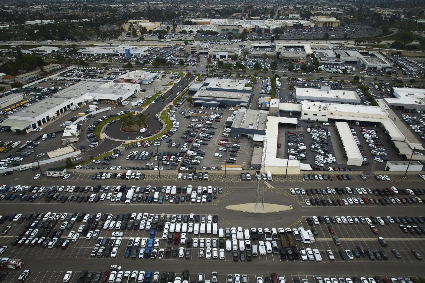 An aerial view shows auto dealerships in Cerritos, Calif., on March 27, 2025.