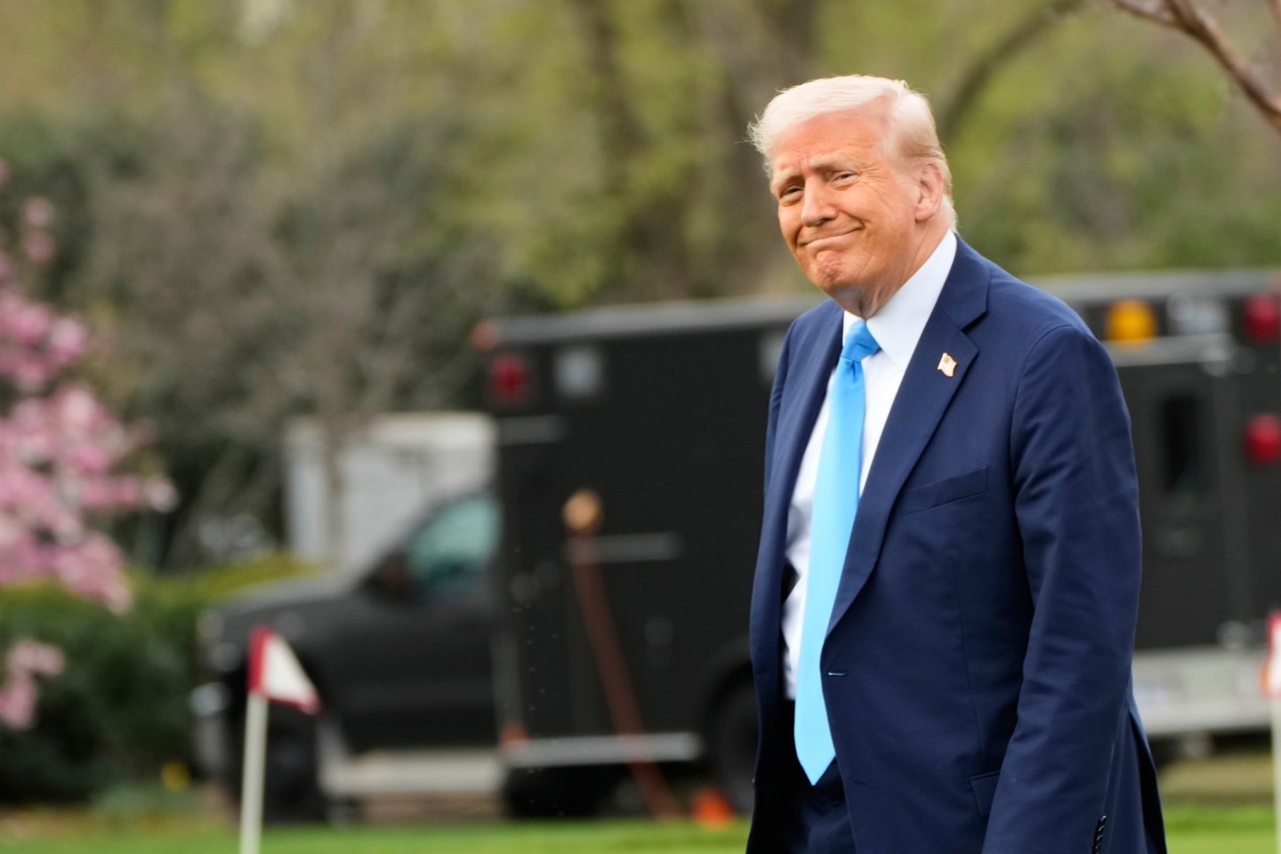 President Donald Trump walks from the Oval Office to board Marine One on the South Lawn of the White House en route to Florida, on Friday.
