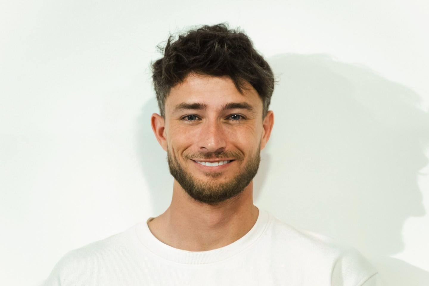 A headshot of Alexander Long