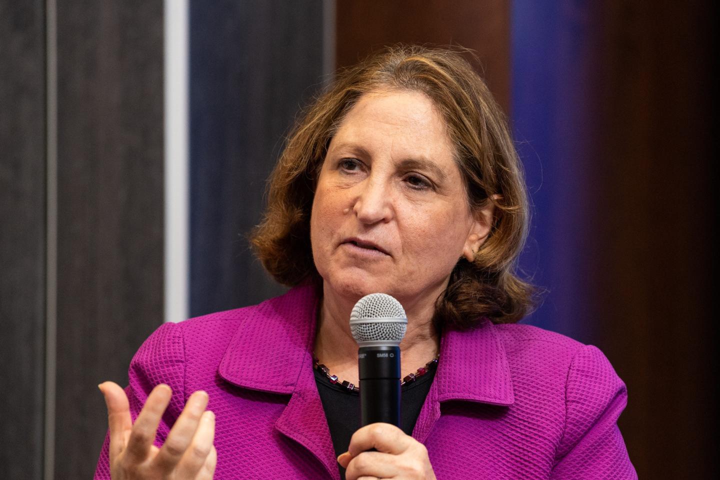 Ruth Marcus speaks into a microphone