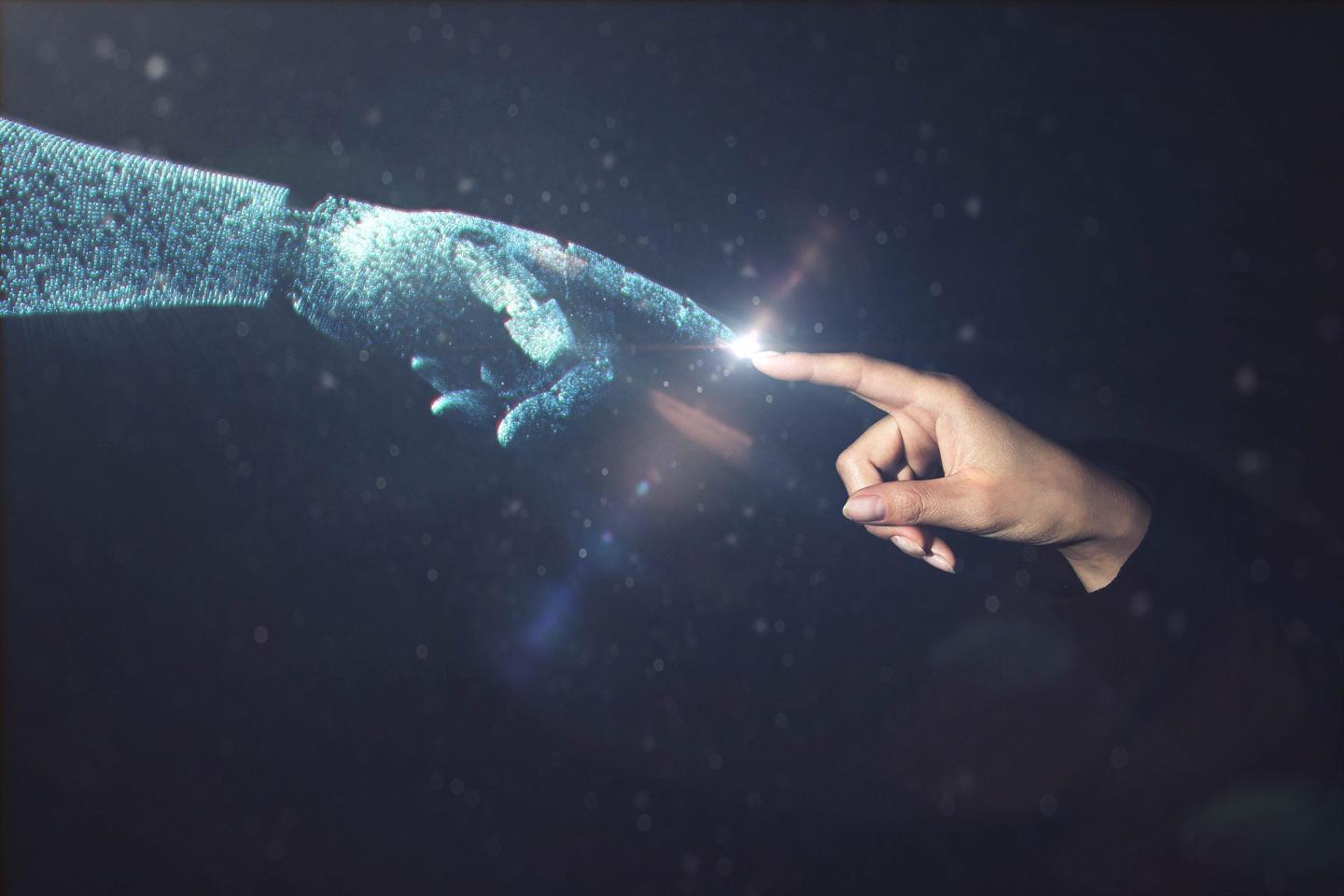 AI robot hand and human hand connect.
