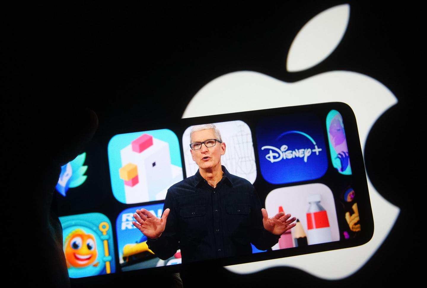 Apple CEO Tim Cook is seen on a mobile phone screen during the 2021 Apple Worldwide Developers Conference (WWDC) in Cupertino, Calif. (Photo Illustration: Pavlo Gonchar/SOPA Images/LightRocket/Getty Images)