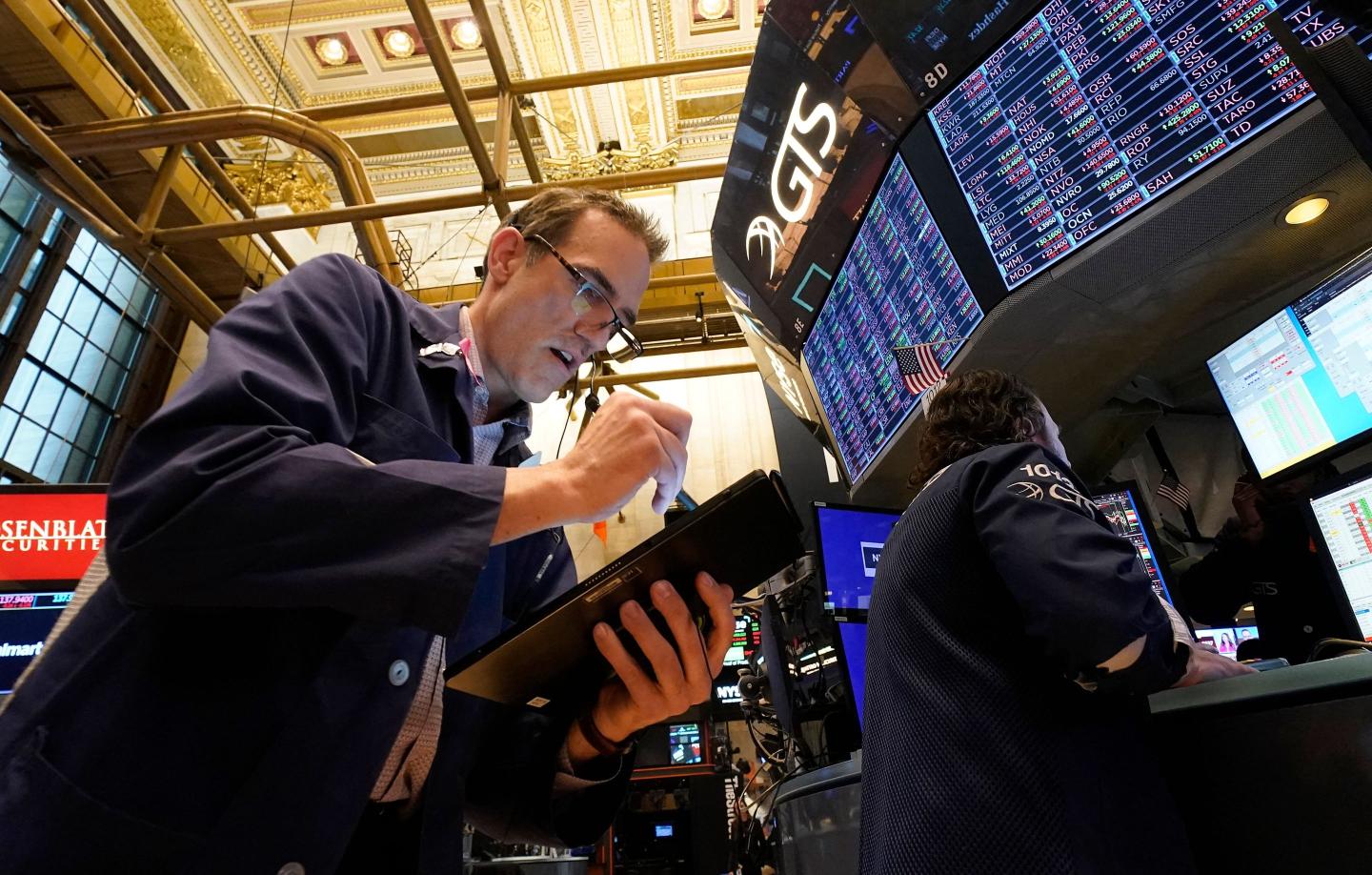 A Wall Street trader looks worried