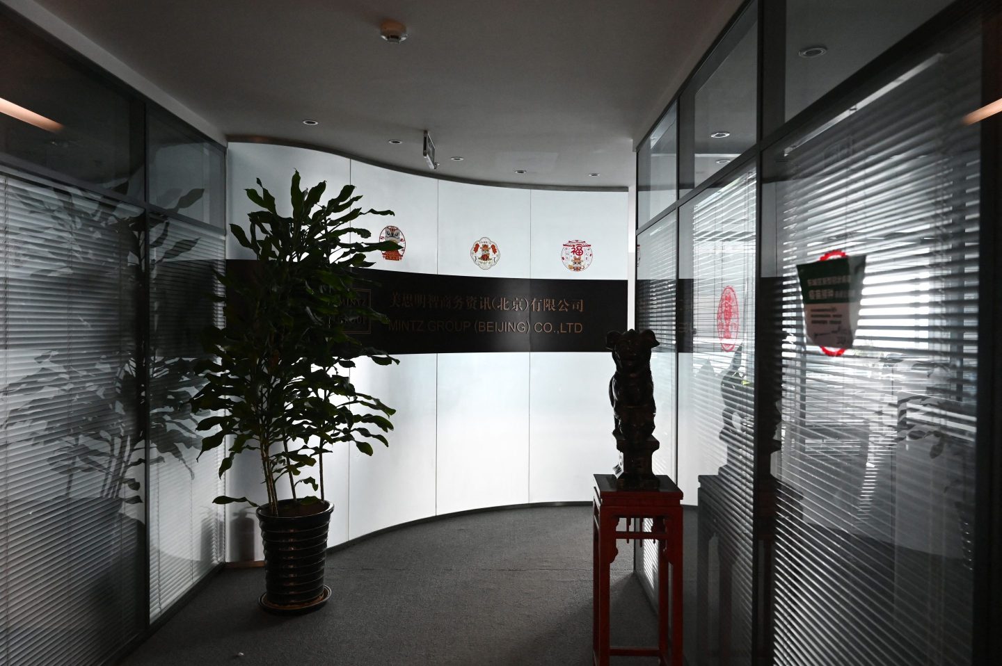 The closed office of the Mintz Group is seen in an office building in Beijing on March 24, 2023. Five Chinese employees at that office had been detained, the company said that day.
