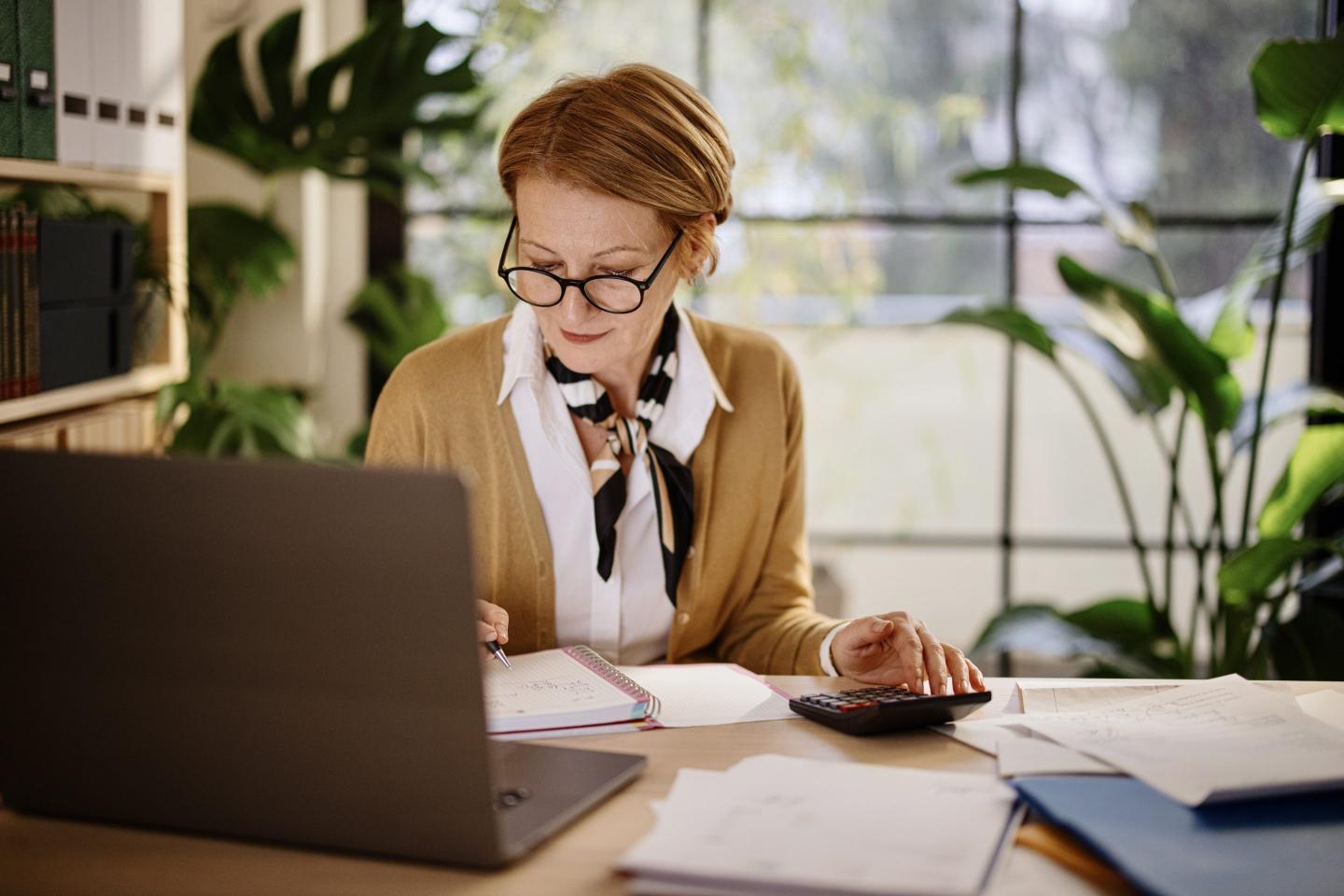 woman working on calculator