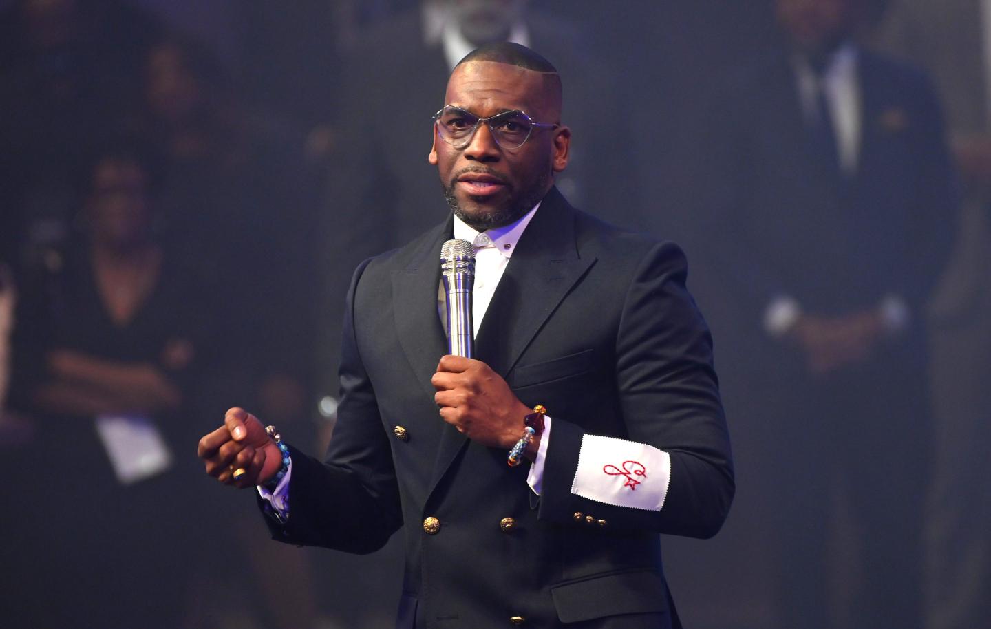 Pastor Jamal speaks onstage at New Birth Missionary Baptist Church.