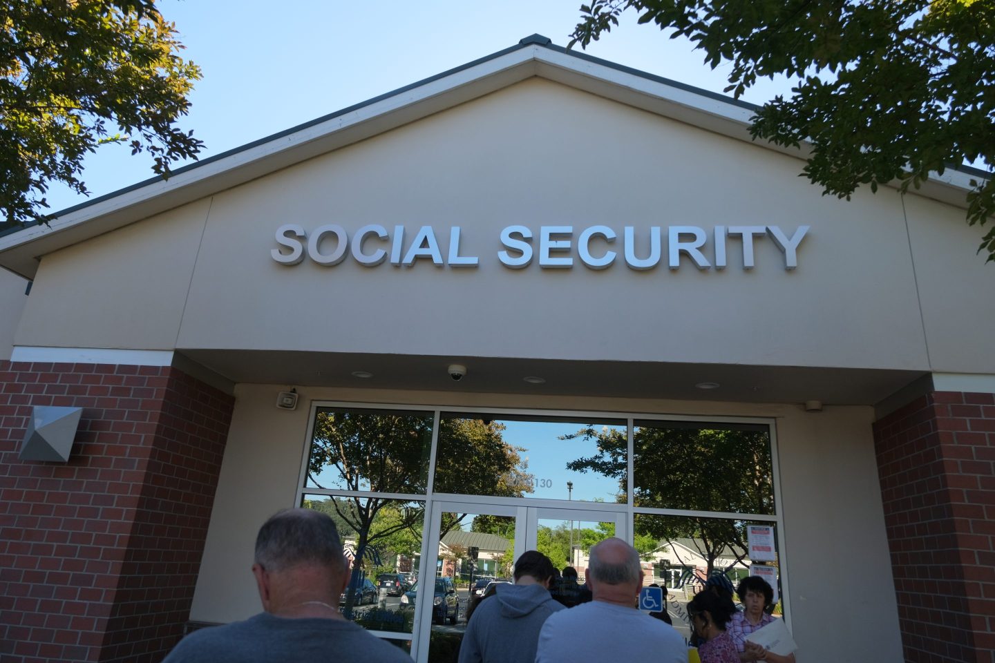 People waiting in front of a Social Security office in Citrus Heights, California, in 2023.