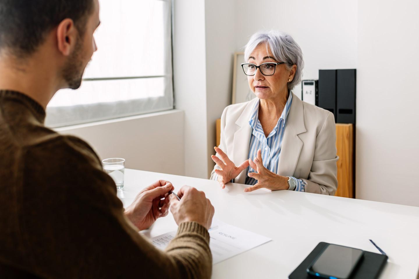 Woman interviews with hiring manager.
