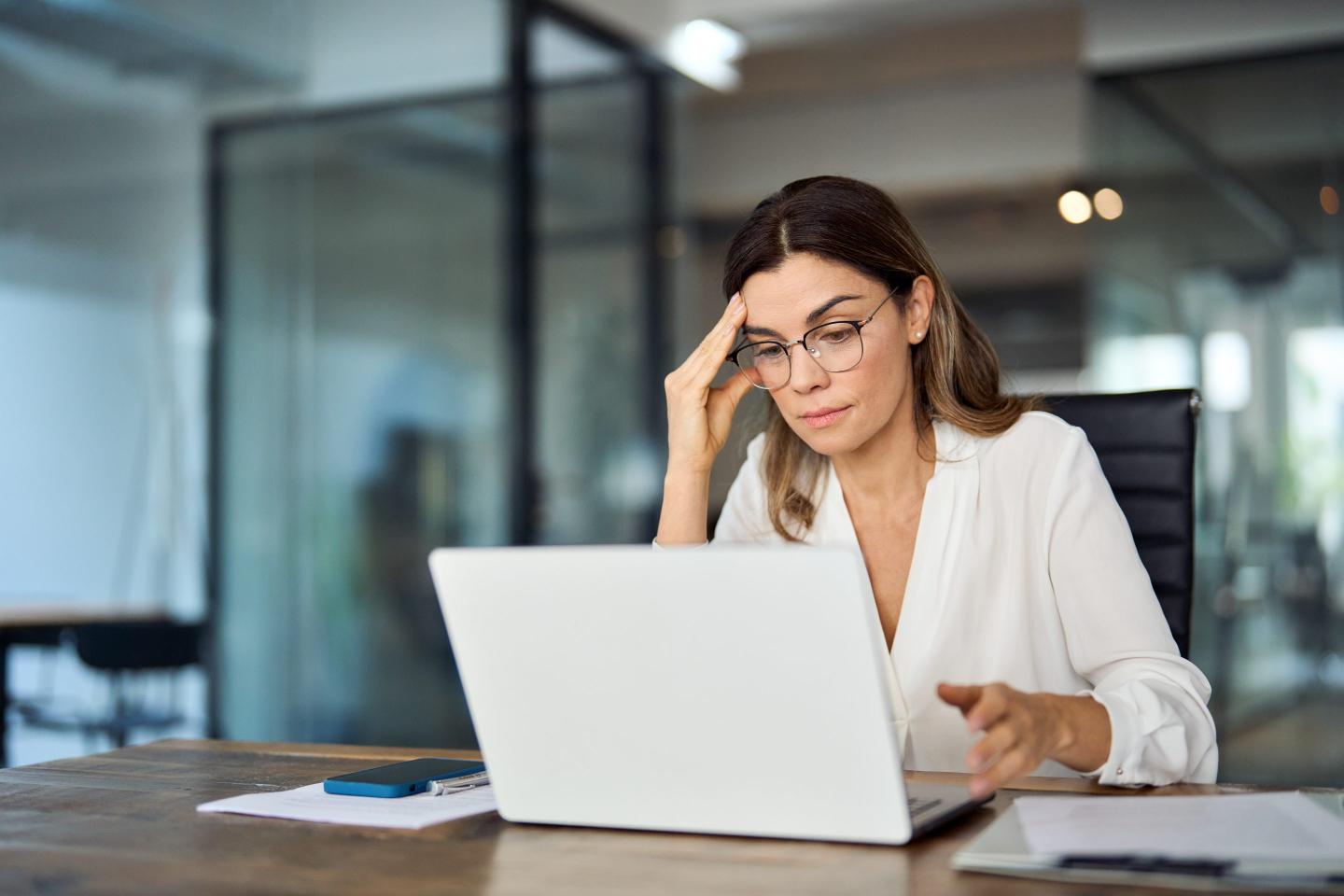 Worried business woman wearing glasses
