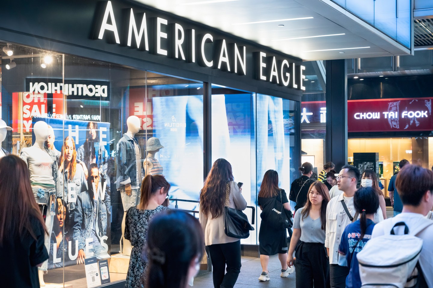 U.S. shoppers stepped up their spending just a bit in February after a sharp pullback the previous month, signaling that Americans are shopping more cautiously as concerns about the direction of the economy mount.