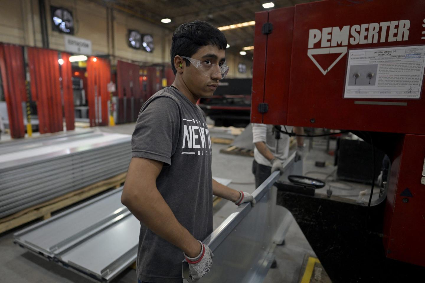 An employee works at the Aztek Technologies plant in Santa Catarina, Nuevo Leon state, Mexico on April 30, 2024. 