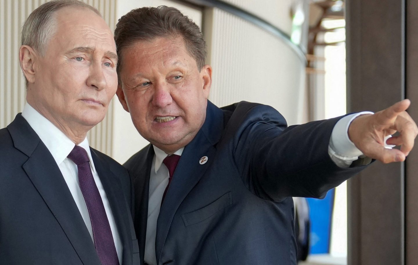 In this pool photograph distributed by Russian state agency Sputnik, Russia's President Vladimir Putin (L) speaks with Russia's energy giant Gazprom CEO Alexei Miller as they visit the Lakhta Centre skyscraper, the headquarters of Russian gas monopoly Gazprom in Saint Petersburg on June 5, 2024.