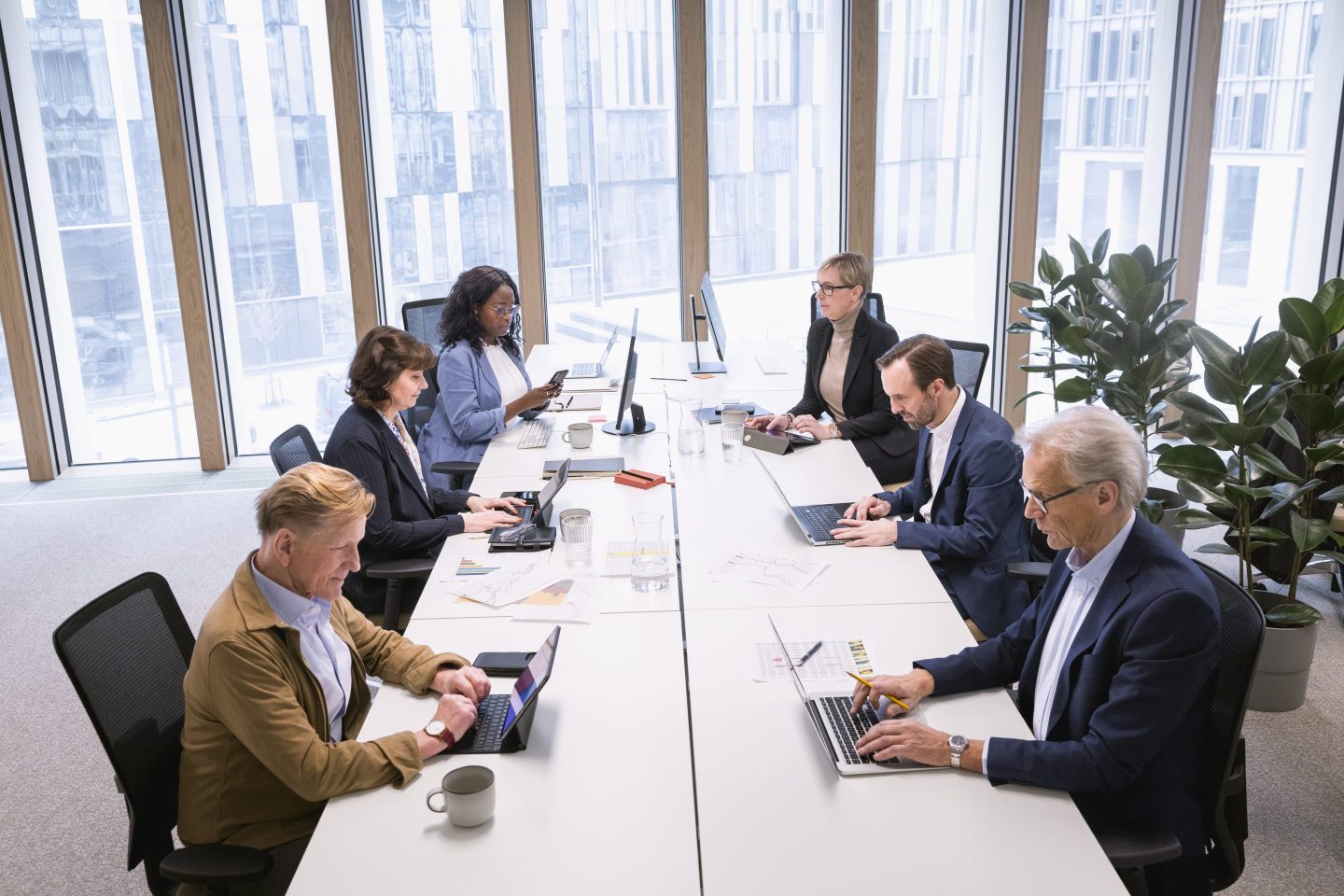 Multiracial corporate colleagues working in office