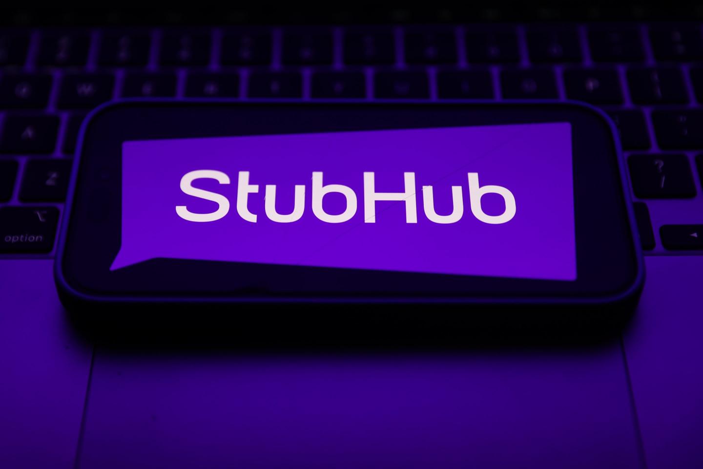 The StubHub logo on a phone screen.