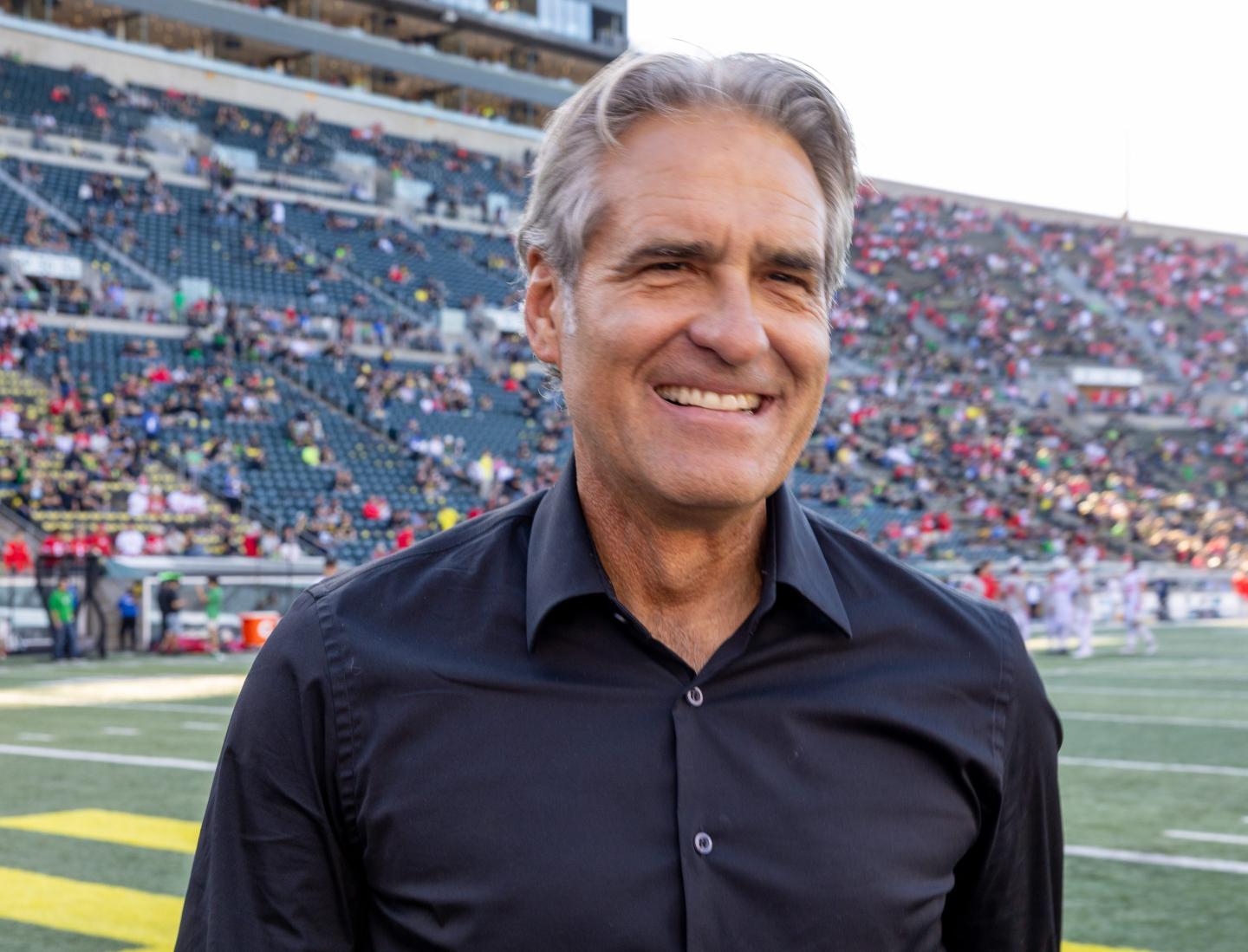 CEO Elliott Hill of Nike smiles on the field before the game between the Oregon Ducks and the Ohio State Buckeyes at Autzen Stadium on October 12, 2024 in Eugene, Oregon.