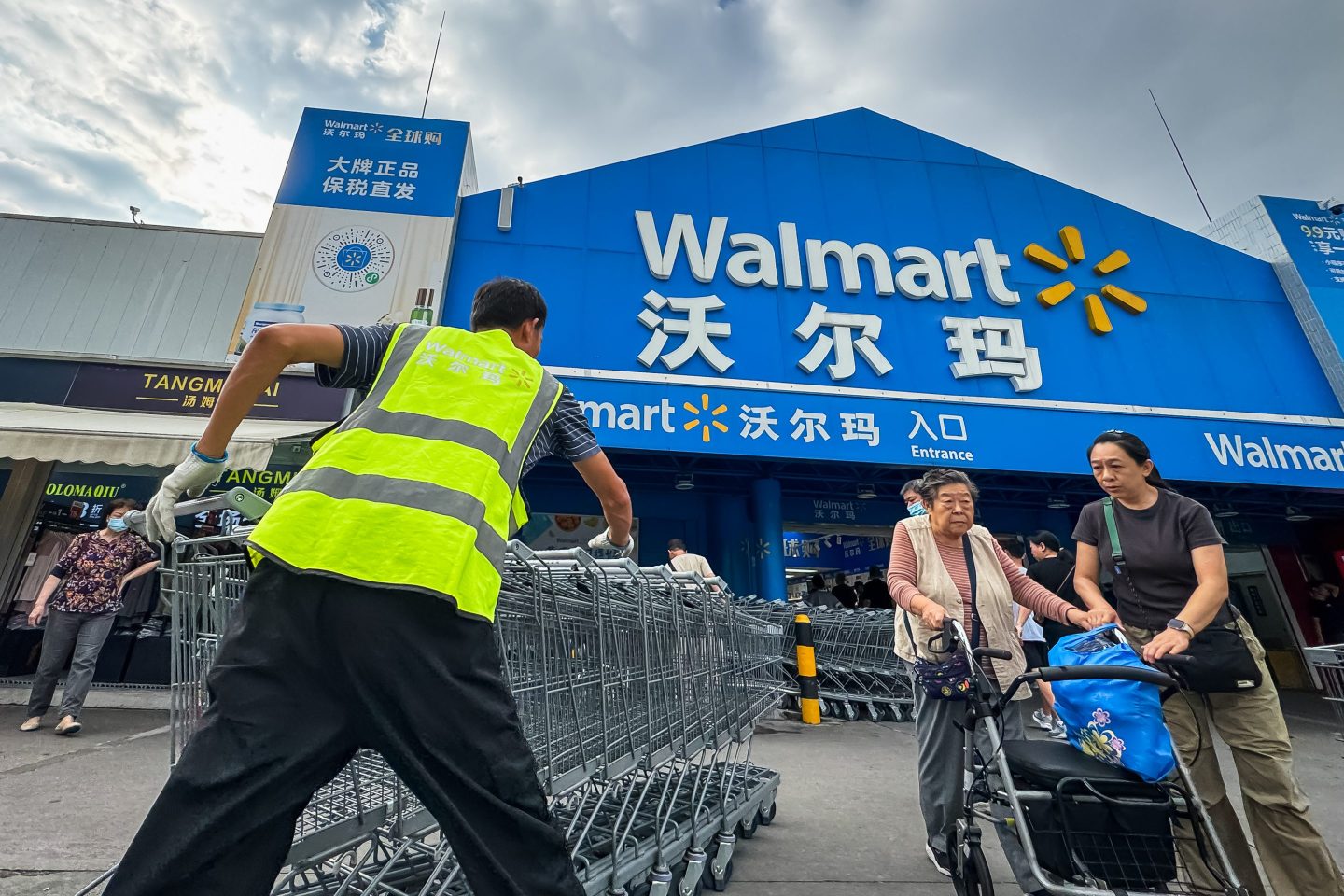 Walmart pushing grocery carts outside of a store in China