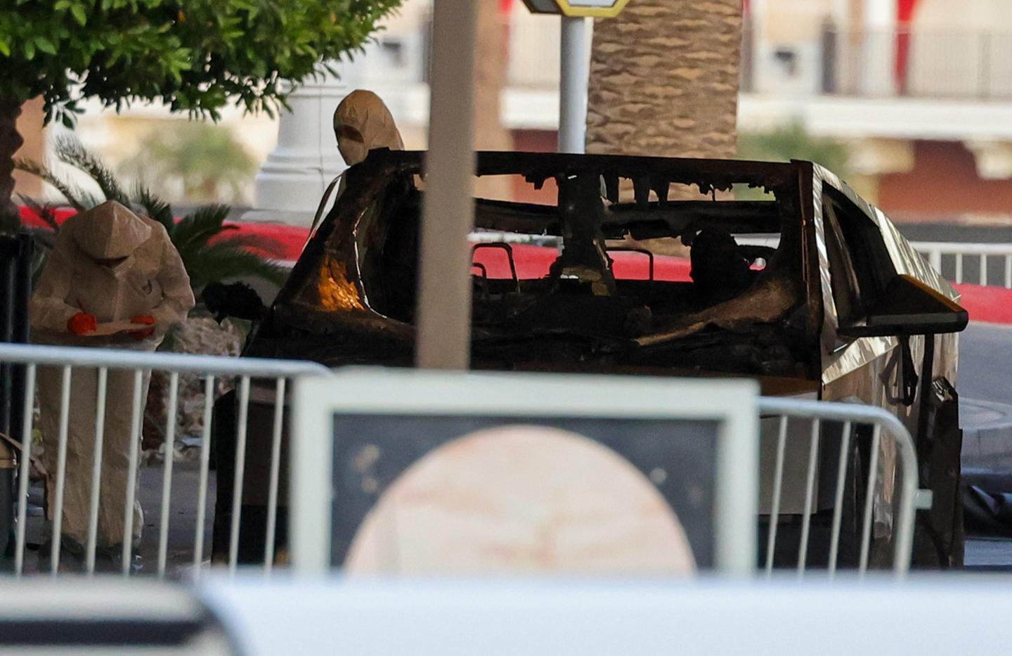 First responders wearing Hazmat gear investigate a Tesla Cybertruck that exploded in front of the entrance to the Trump International Hotel & Tower Las Vegas on January 01, 2025 in Las Vegas, Nevada.
