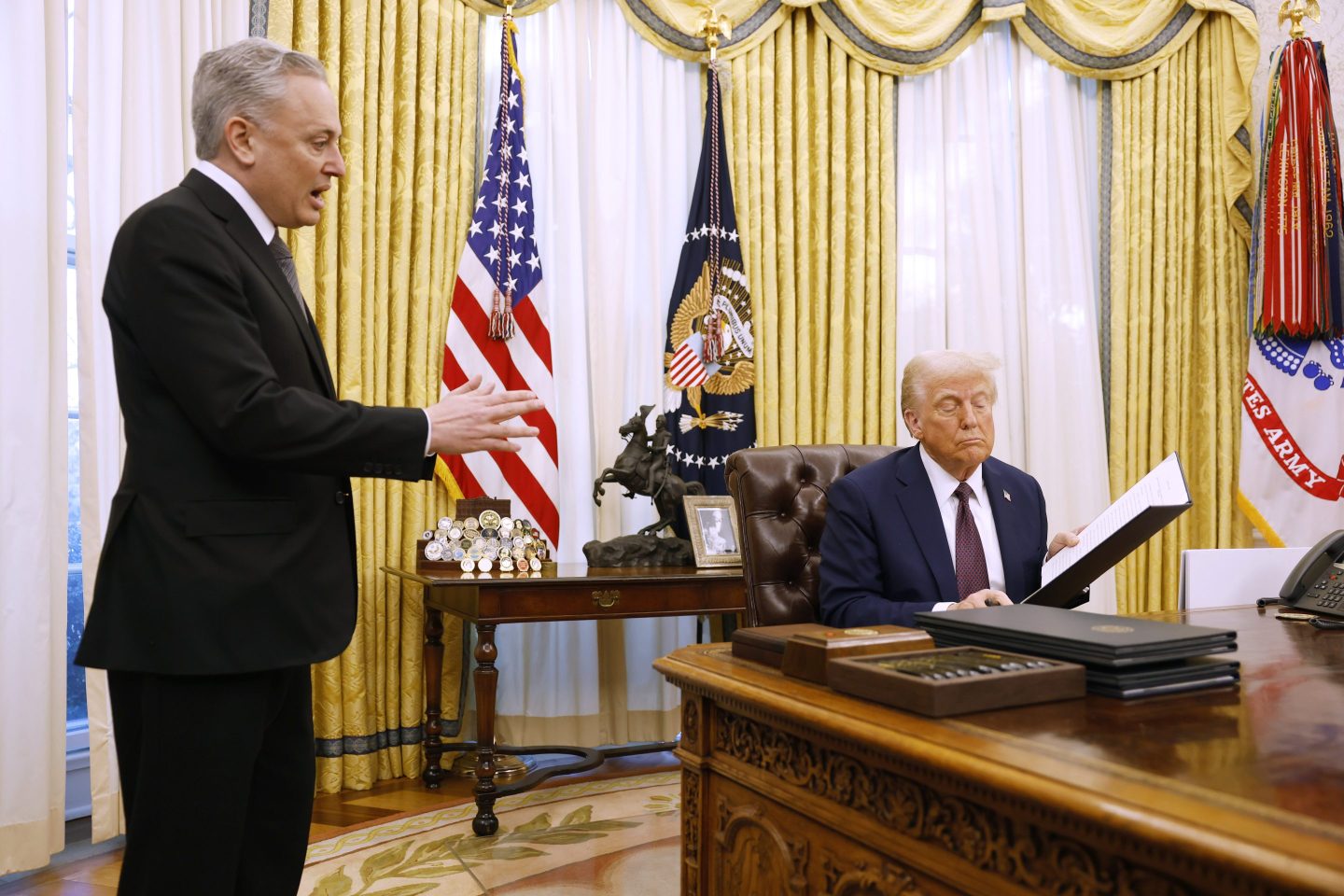 Crypto czar David Sacks speaks to President Donald Trump in the White House in January.