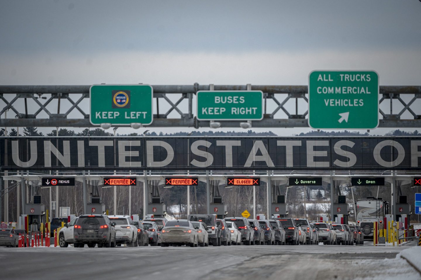 Cars wait in line to enter the United States at a border crossing at the Canada-US border in Blackpool, Quebec, Canada, on Feb. 2, 2025.