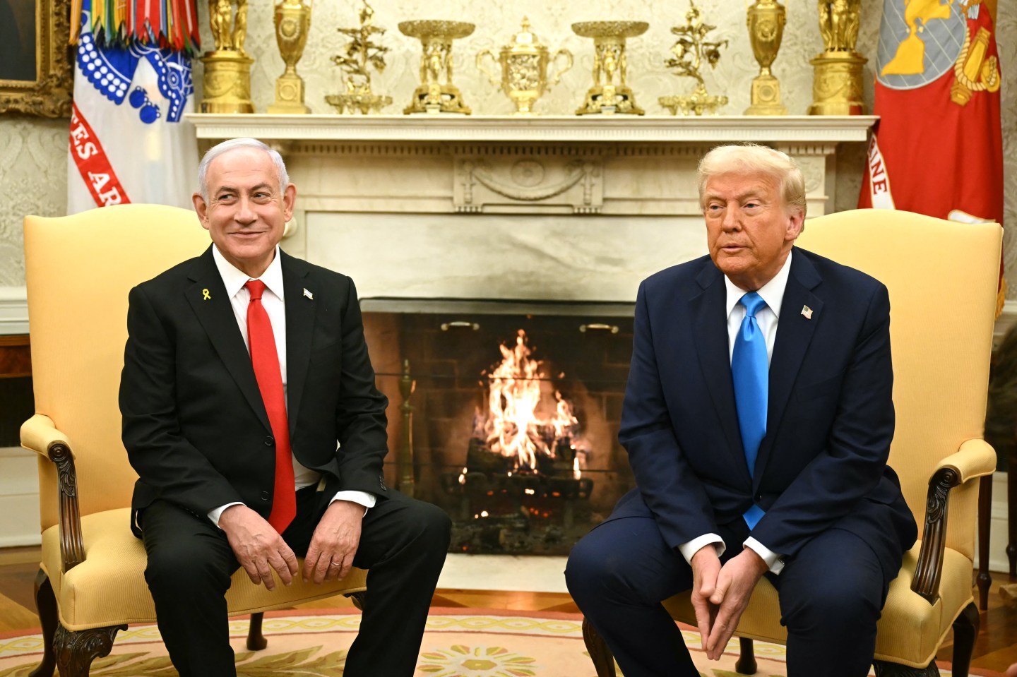 Donald Trump sitting next to Israel's Prime Minister Benjamin Netanyahu.