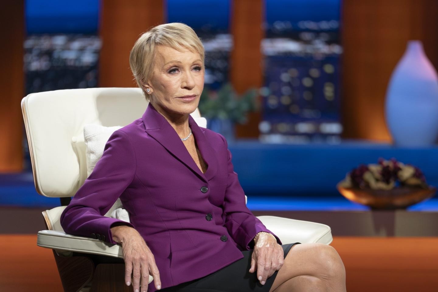 Barbara Corcoran sits in a chair on the Shark Tank set.