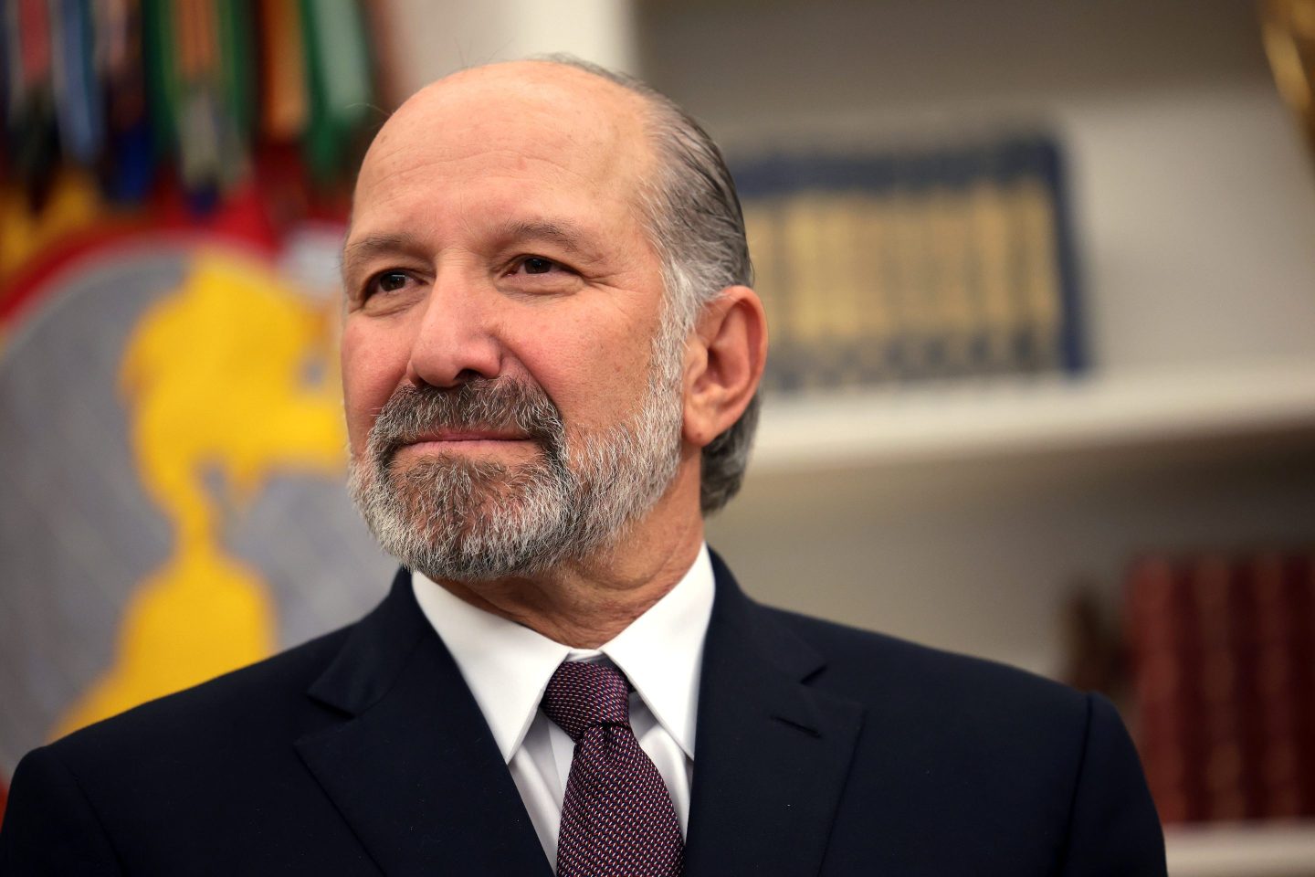 Howard Lutnick looks off camera and smiles.