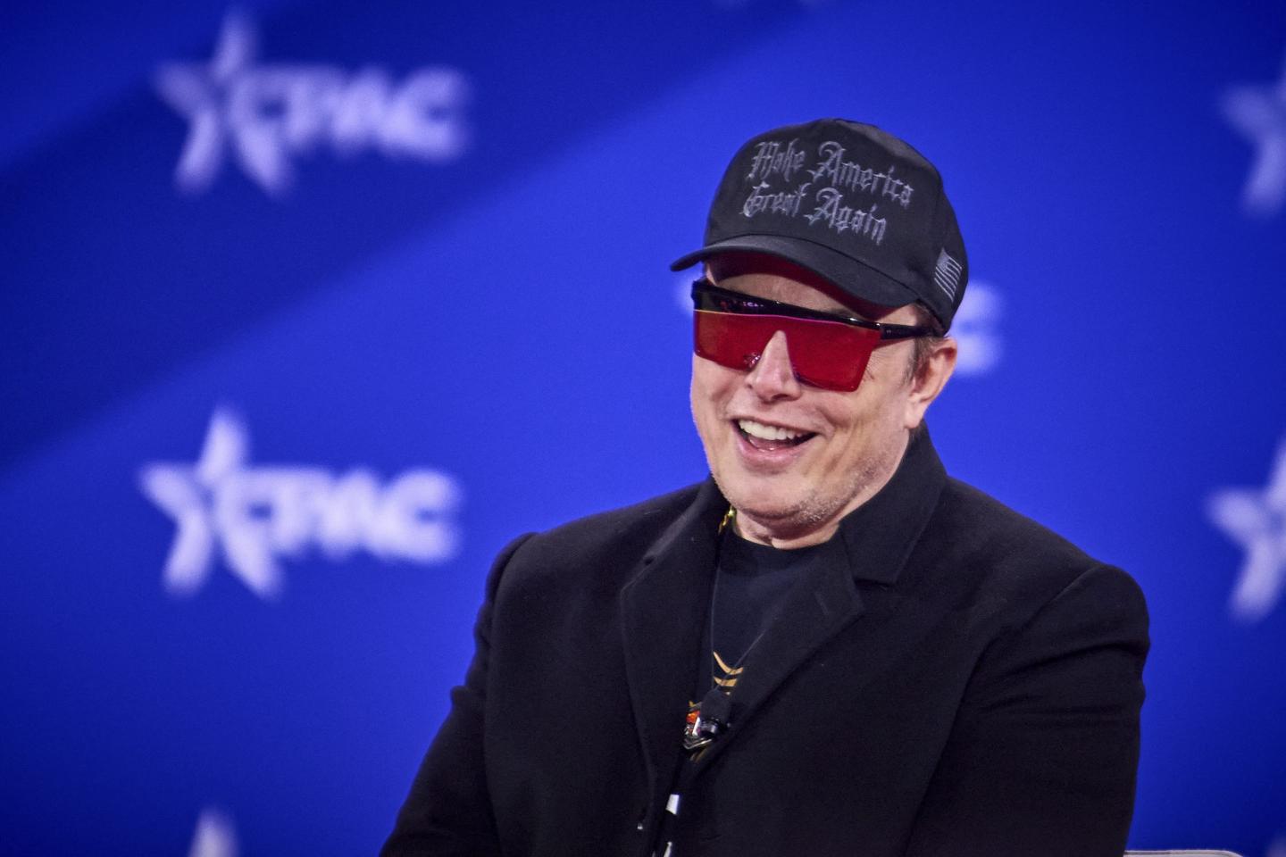 Elon Musk speaks during the CPAC-DC in Oxon, Md.
