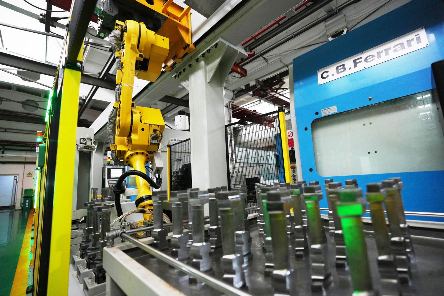 A robotic arm operates at a smart production line