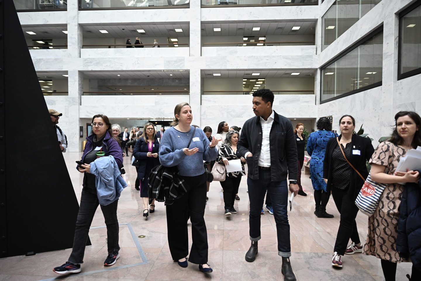 Federal workers gather at the Hart Senate Office Building to discuss recent layoffs with U.S. Senators, in Washington D.C., United States on March 4, 2025. During a meeting with U.S. Senator Chris Murphy, the workers sought support to ensure their concerns were heard by the authorities.