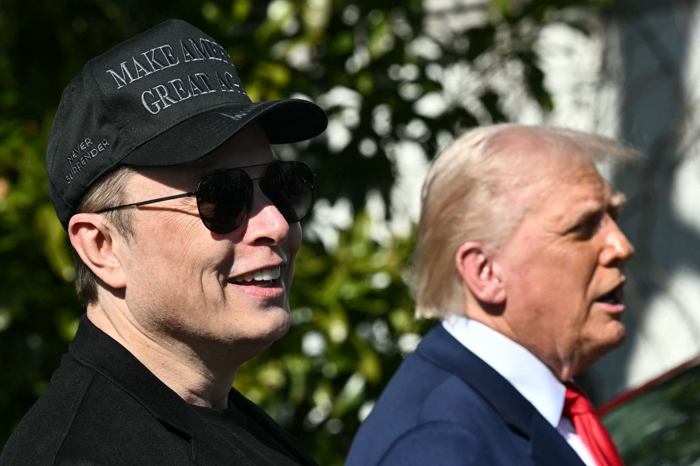 US President Donald Trump and Tesla CEO Elon Musk speak to the press as they stand next to a Tesla vehicle on the South Portico of the White House on March 11, 2025 in Washington, DC.
