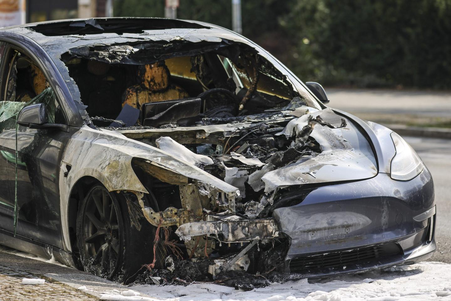 The burnt-out remains of a Tesla electric car in the Steglitz district on March 14, 2025 in Berlin, Germany.