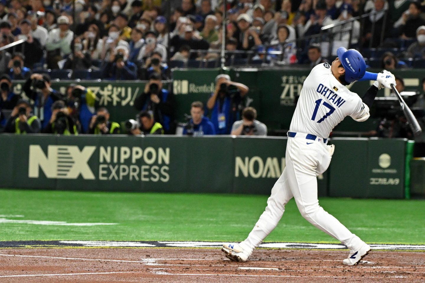 Shohei Ohtani #17 of the Los Angeles Dodgers flies out in the top of the third inning against Hanshin Tigers at Tokyo Dome on March 16, 2025 in Tokyo, Japan.