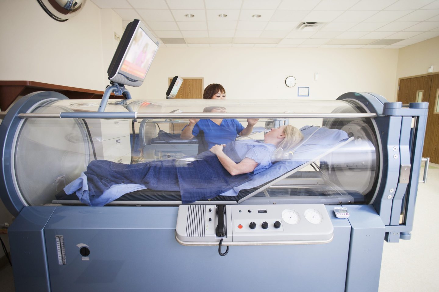 A patient in a hyperbaric oxygen chamber in a medical setting