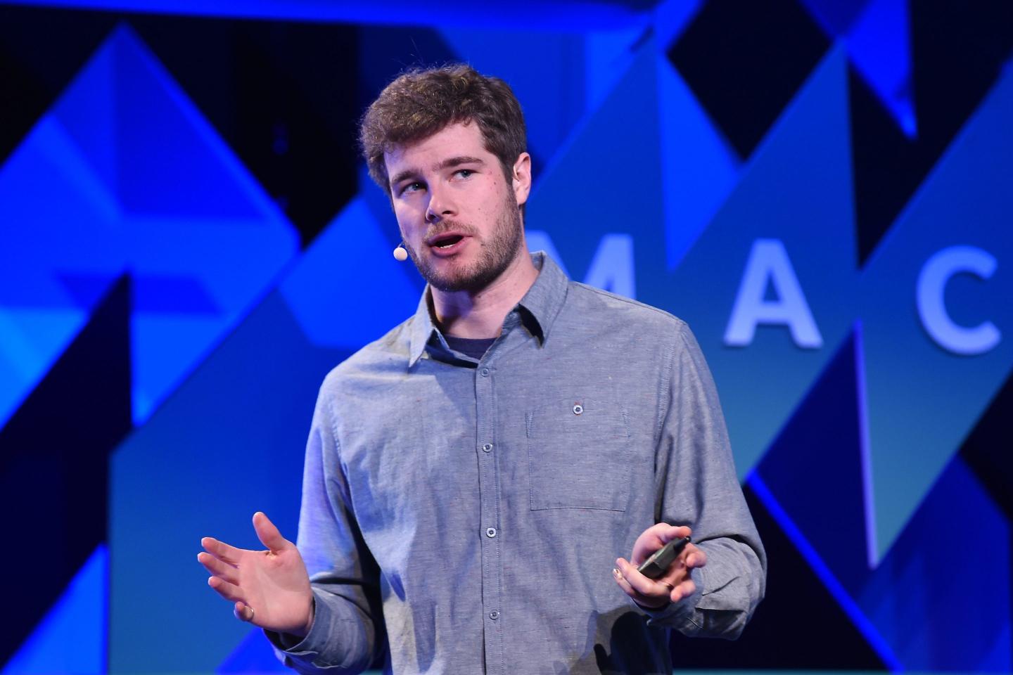 Eric Migicovsky speaks on stage