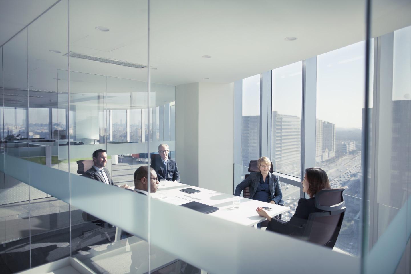 office workers sitting in a meeting room