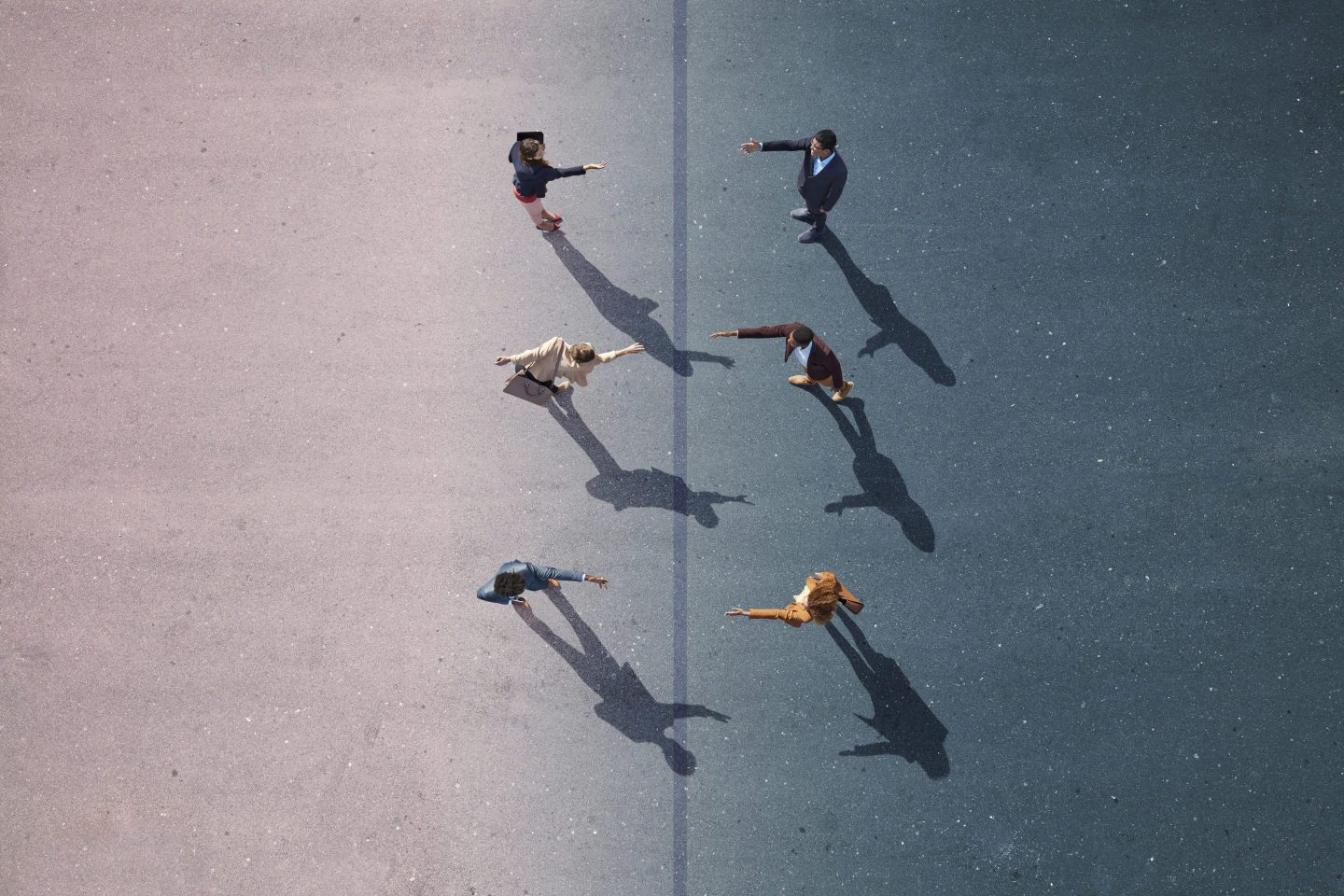 aerial view of adults walking on a tarmac