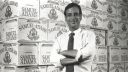 Founder Jim Koch poses by cases of Samuel Adams.