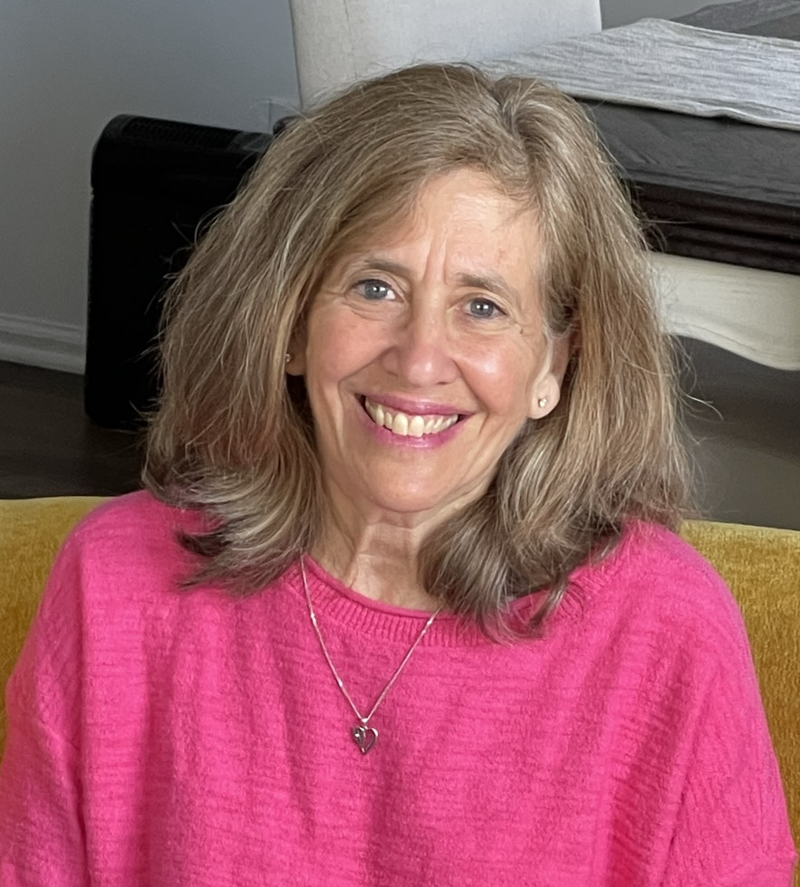 closeup of middle-aged woman in hot-pink top