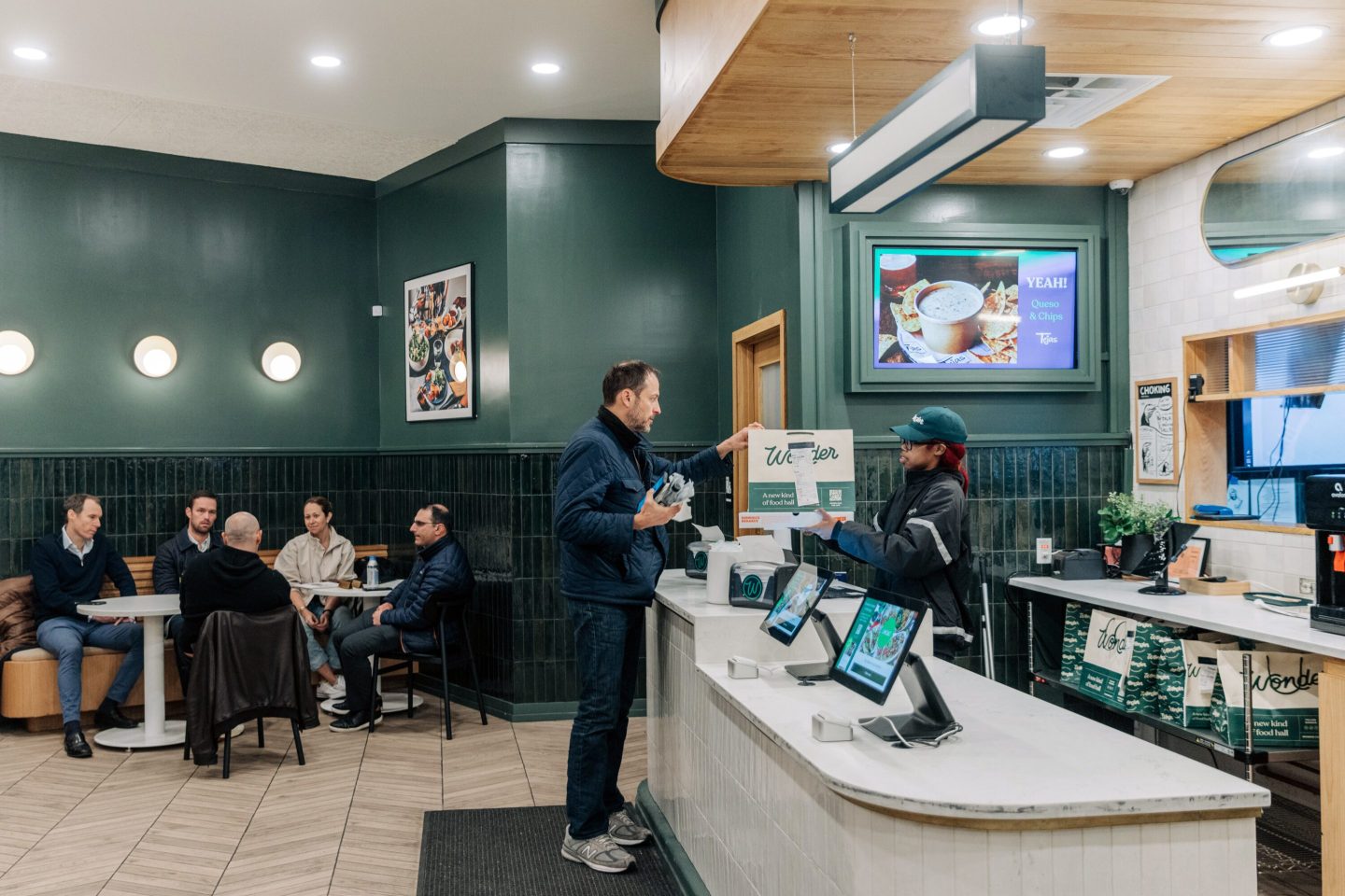 A customer picks up his food at a Wonder restaurant.