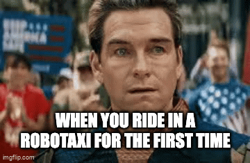 A meme of the character Homelander from the series "The Boys" breaking into a smile with the caption, "When you ride in a robotaxi for the first time"