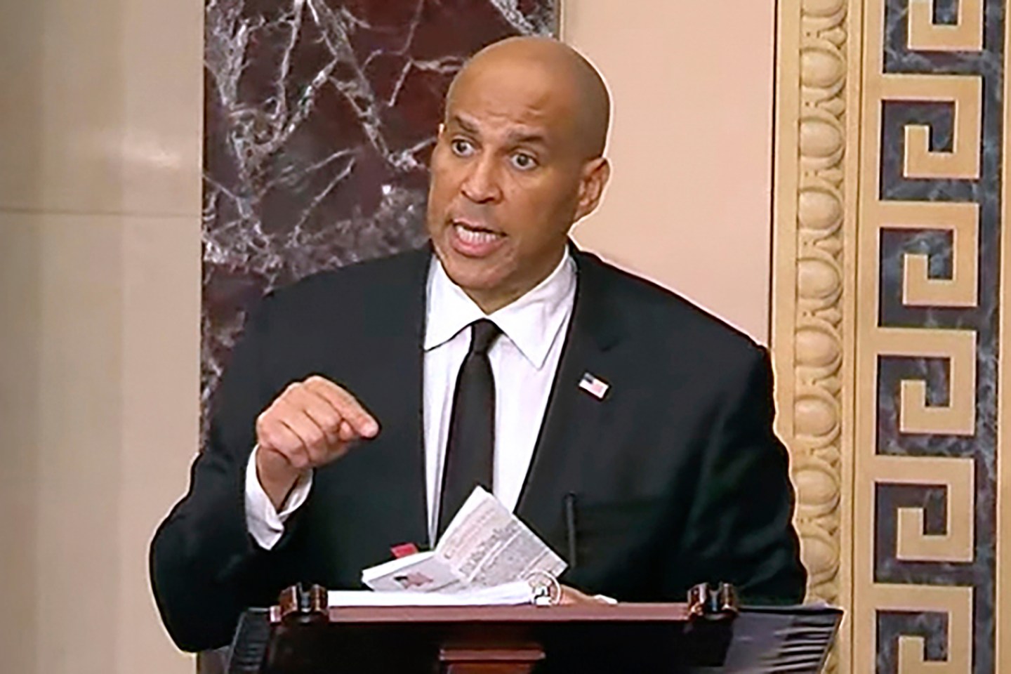 Cory Booker stands on the Senate floor