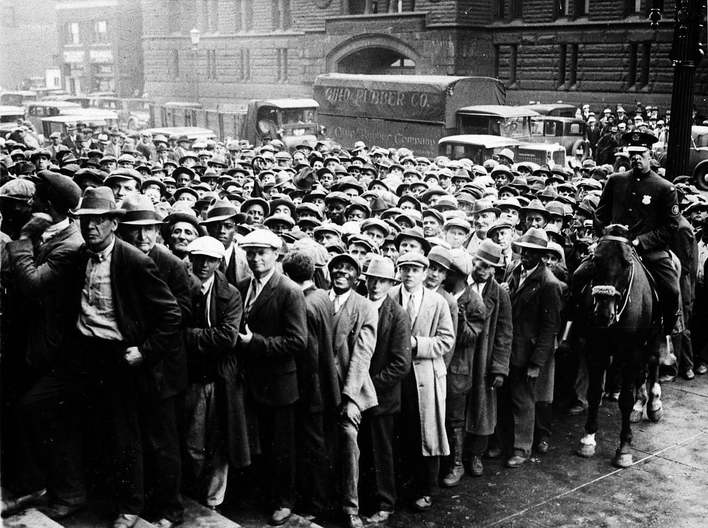 Thousands of unemployed people gather outside City Hall in Cleveland during the Great Depression, after some 2,000 jobs were made available for park improvements and repairs, Oct. 9, 1930.
