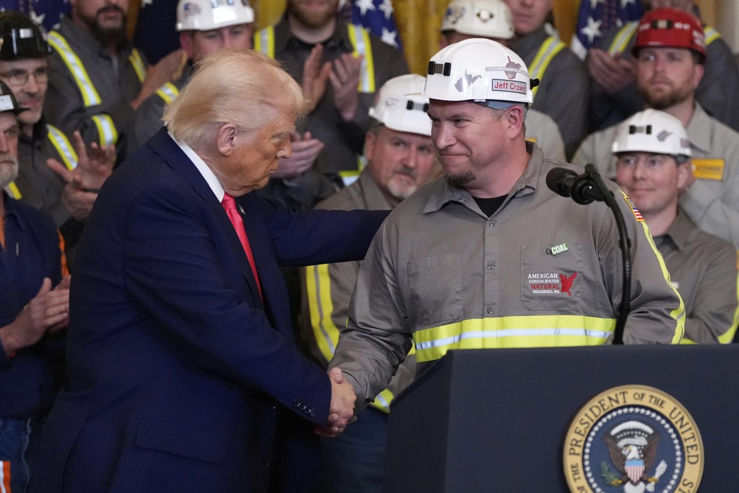 President Donald Trump shakes hands with coal miner Jeff Crowe during an event on energy production in the East Room of the White House, on April 8, 2025, in Washington.