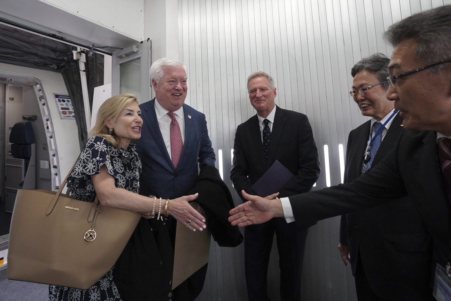 George Glass, America's ambassador to Japan, welcomes representatives from Tokyo