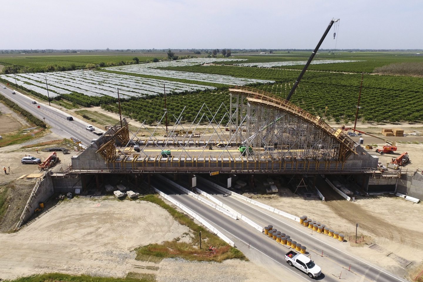 The Tied Arch Bridge construction site, which will take high-speed trains over State Route 43, is shown in an aerial view April 15, 2025, in Fresno County, Calif.