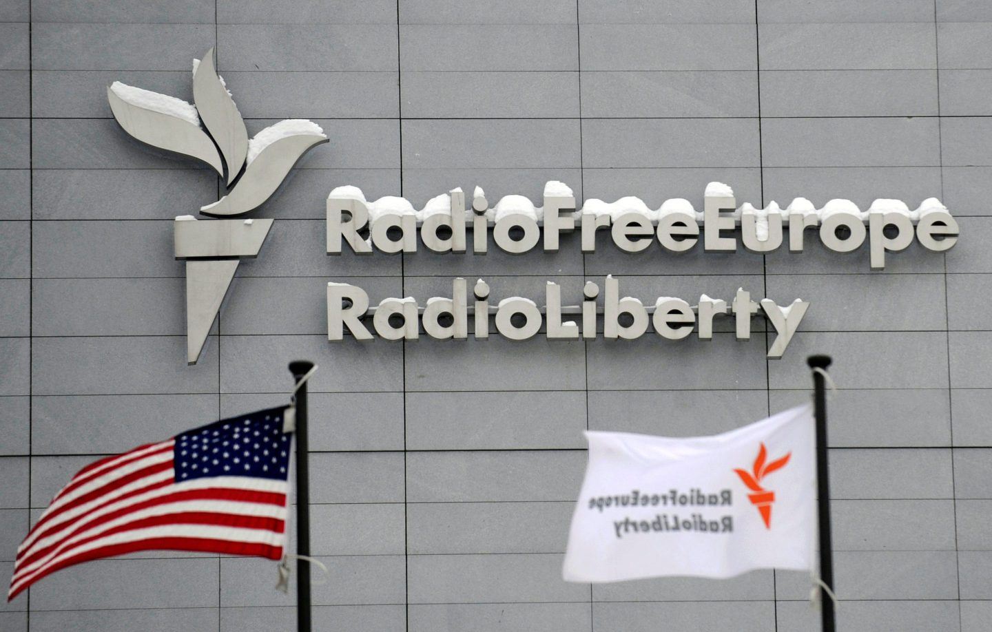 The headquarters of Radio Free Europe/Radio Liberty is seen with the United States flag in the foreground, Jan. 15, 2010, in Prague.