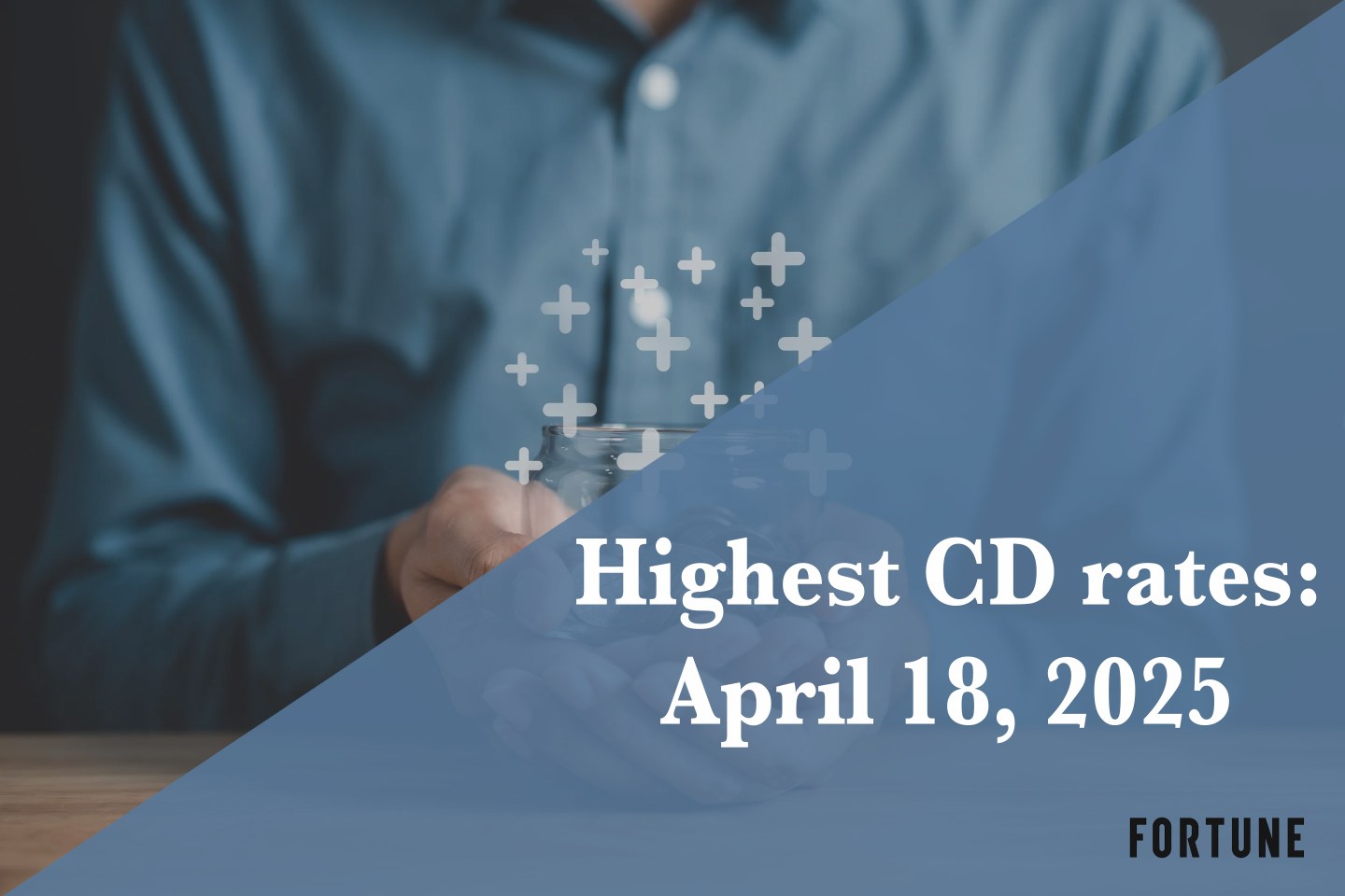 A person holding a jar full of coins.