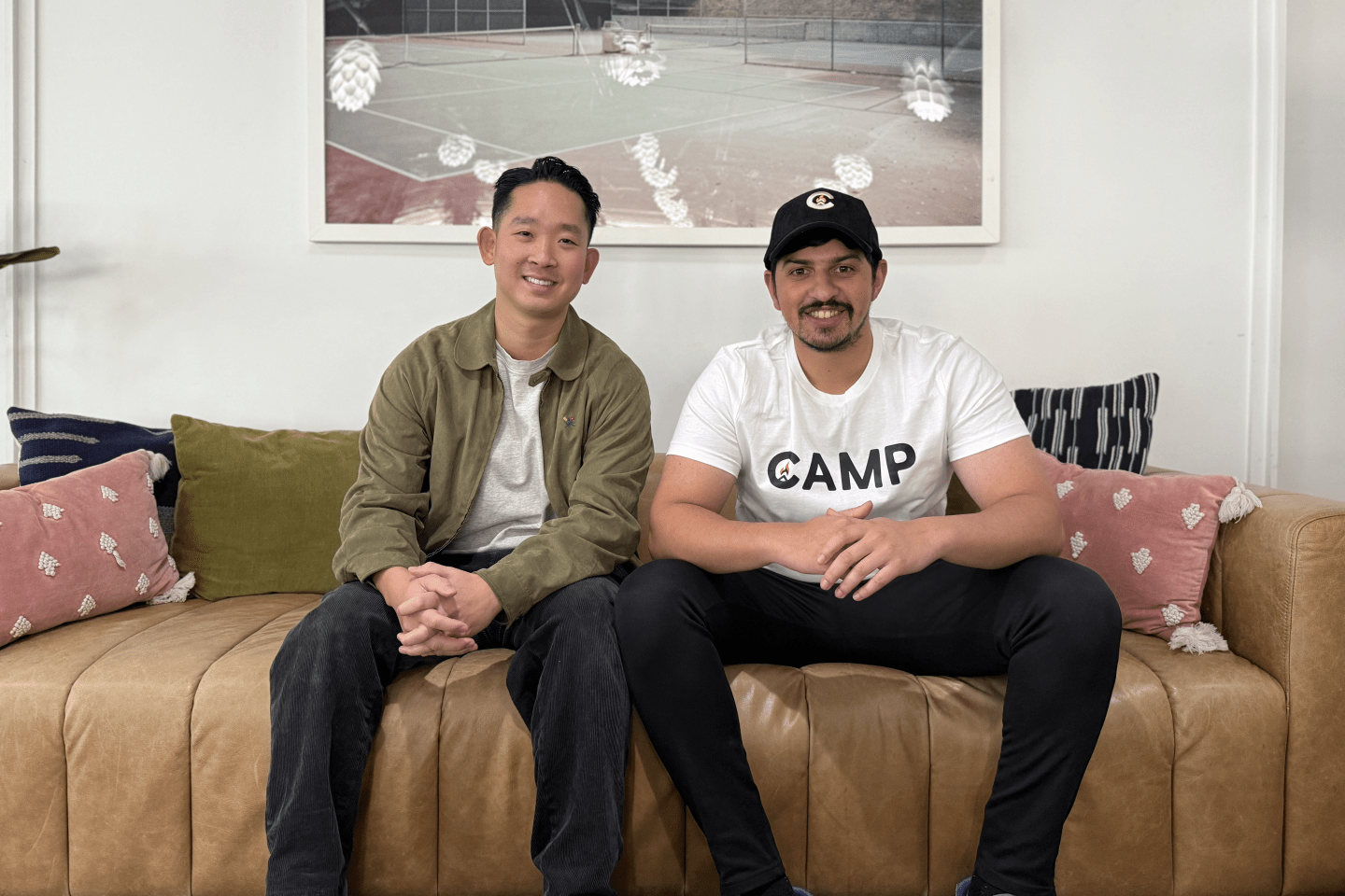 James Chi and Nirav Murthy sit on a couch together.