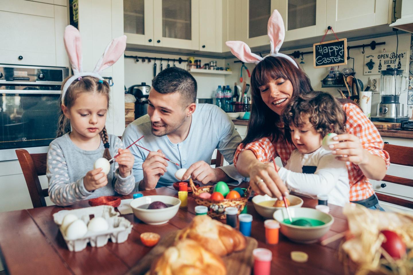 family painting Easter eggs