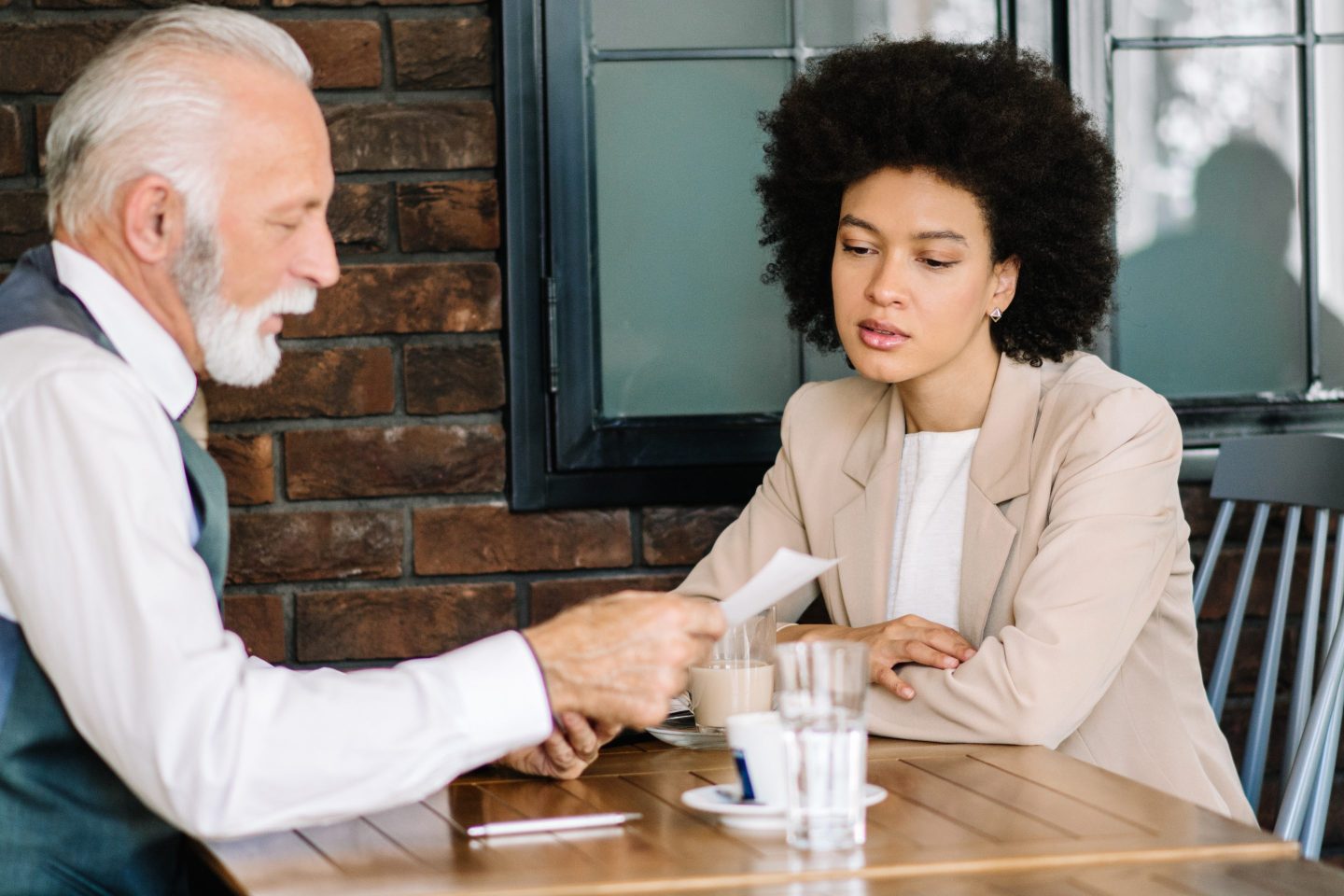 Business man and woman looking at documents together